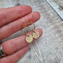 Load image into Gallery viewer, Gold hammered disc and circle drop earrings. Each earring has one gold filled open circle attached to gold earring wire. Dropping from the open circle is a gold-filled disc with hammered texture, measuring approximately 10mm diameter. Total drop from earlobe approximately 30mm providing lots of movement.