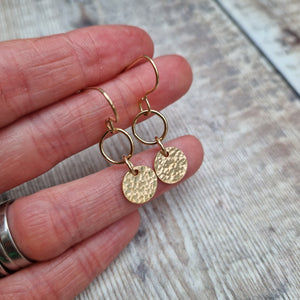 Gold hammered disc and circle drop earrings. Each earring has one gold filled open circle attached to gold earring wire. Dropping from the open circle is a gold-filled disc with hammered texture, measuring approximately 10mm diameter. Total drop from earlobe approximately 30mm providing lots of movement.