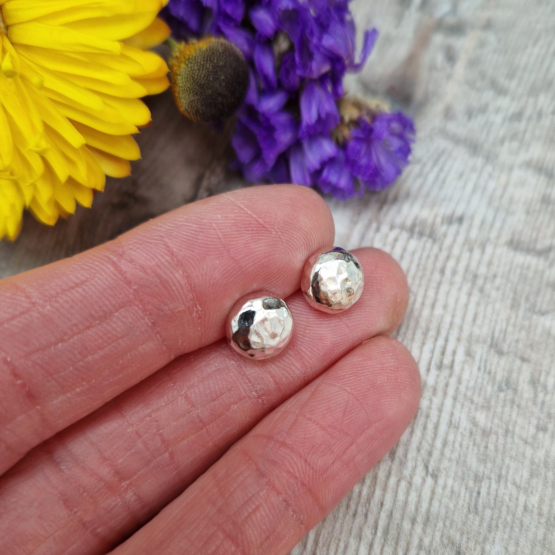 Each earring is a Sterling Silver sphere with hammered texture attached to silver earring bar.