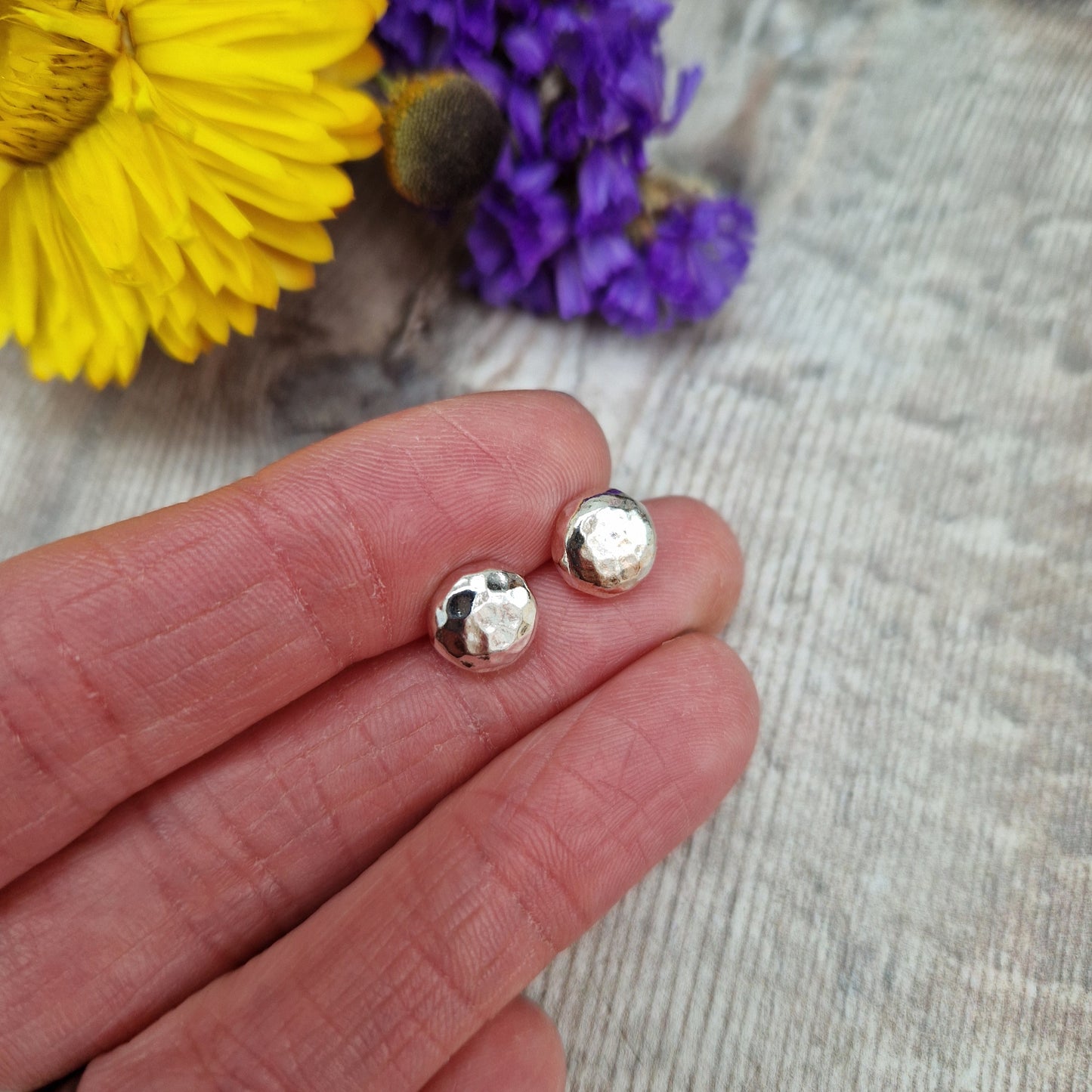 Each earring is a Sterling Silver sphere with hammered texture attached to silver earring bar.