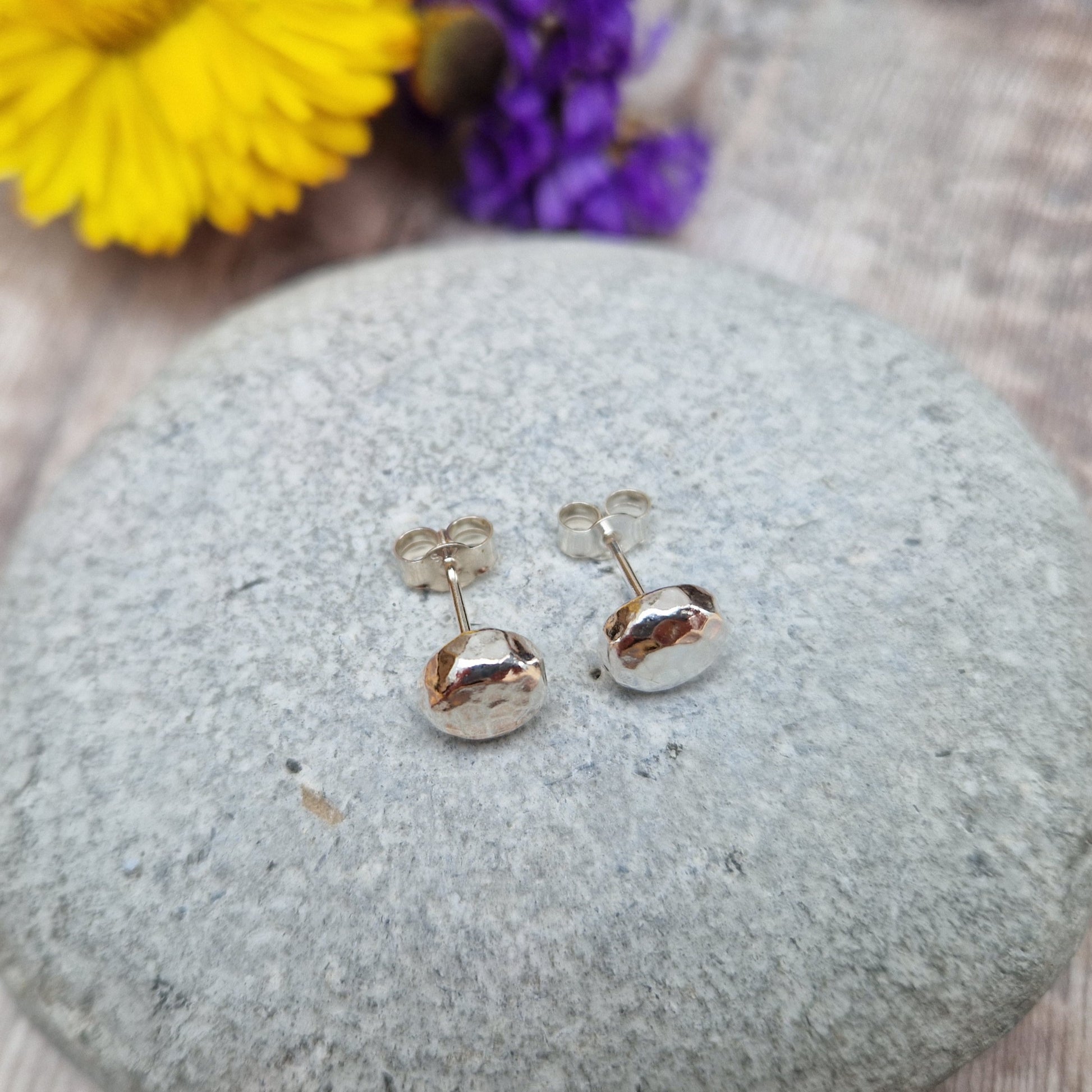 Each earring is a Sterling Silver sphere with hammered texture attached to silver earring bar.