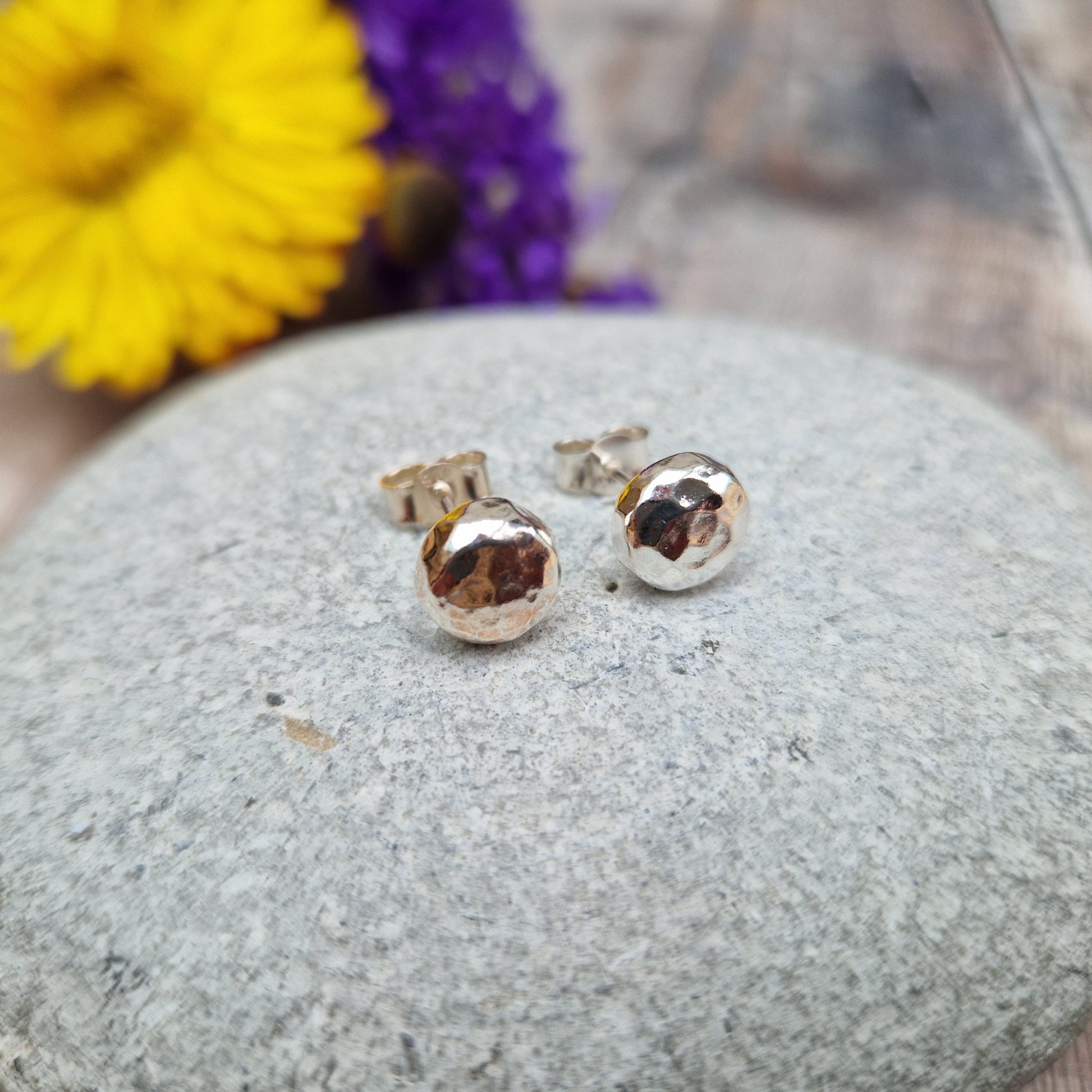 Each earring is a Sterling Silver sphere with hammered texture attached to silver earring bar.