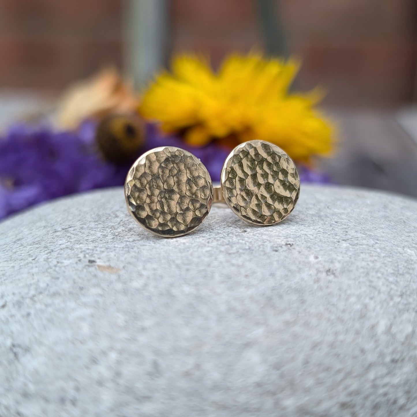 9ct gold hammered disc stud earrings. Each earring has one gold disc with hammered texture mounted on gold bar. Disc measuring approximately 8mm, 10mm or 12mm in diameter.