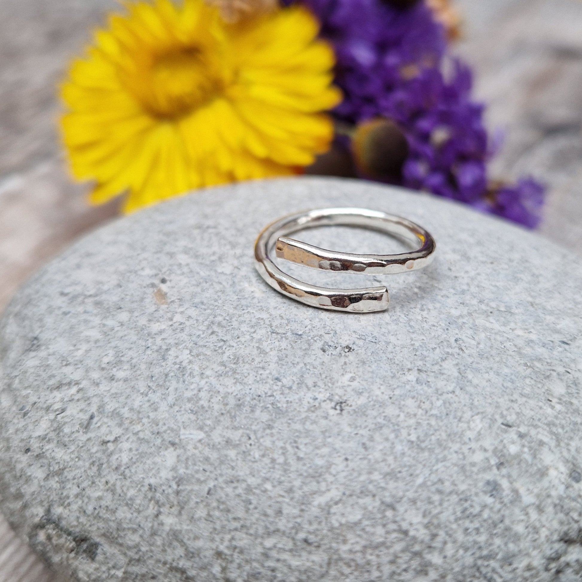 Sterling Silver hammered texture ring that wraps around the finger and overlaps.