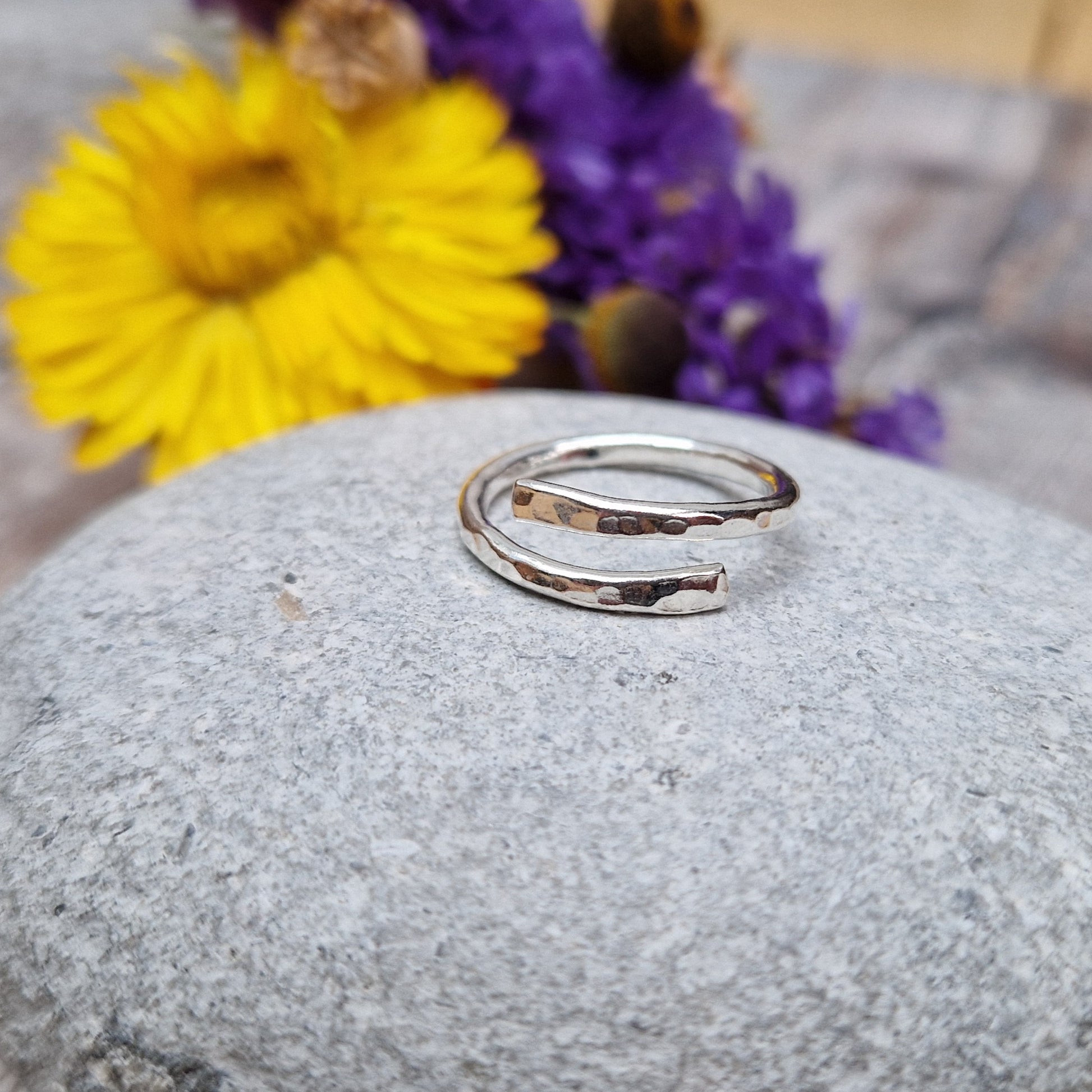 Sterling Silver hammered texture ring that wraps around the finger and overlaps.