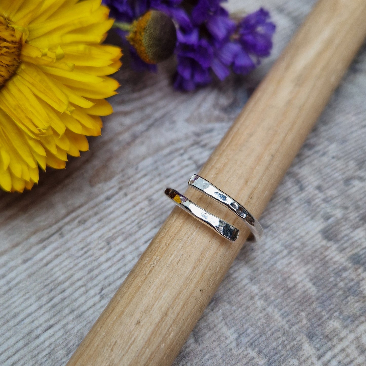 Sterling Silver hammered texture ring that wraps around the finger and overlaps.