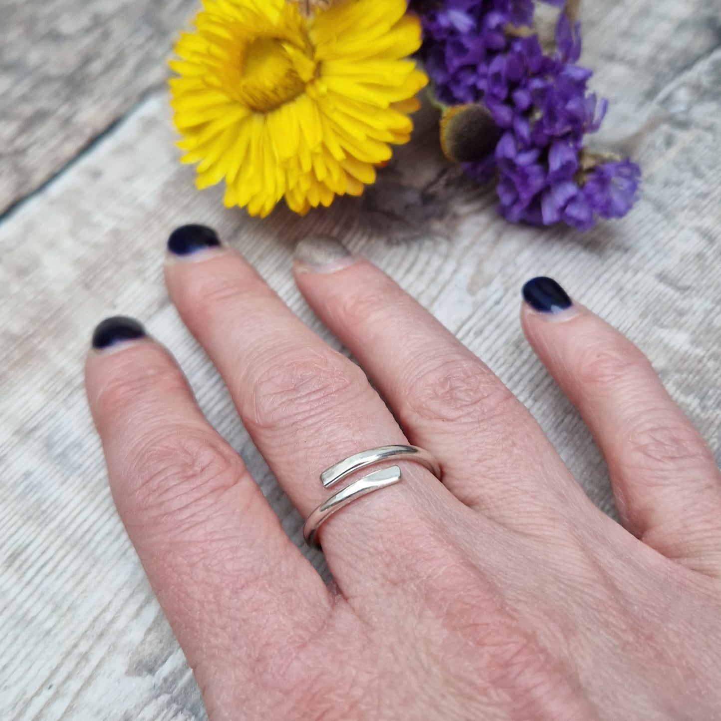 Sterling Silver ring that wraps around the finger and overlaps.