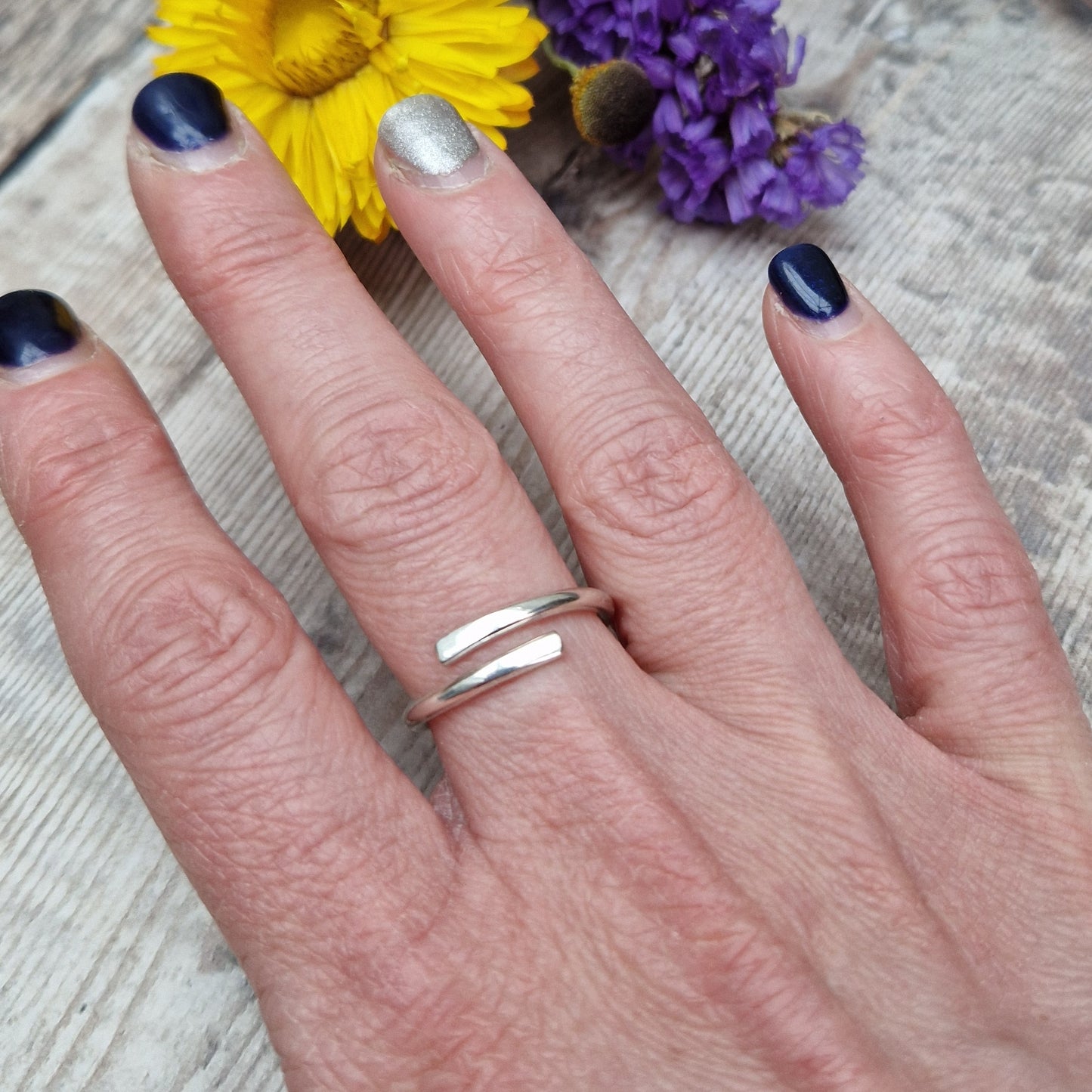 Sterling Silver ring that wraps around the finger and overlaps.