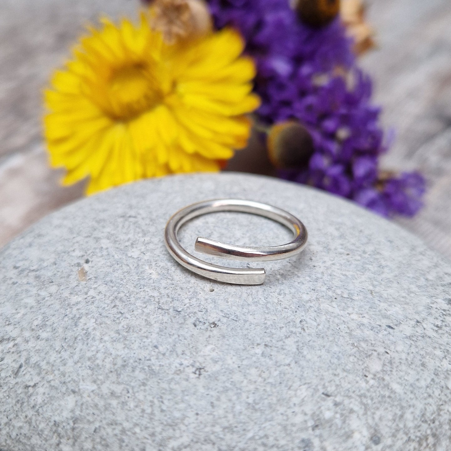 Sterling Silver ring that wraps around the finger and overlaps.