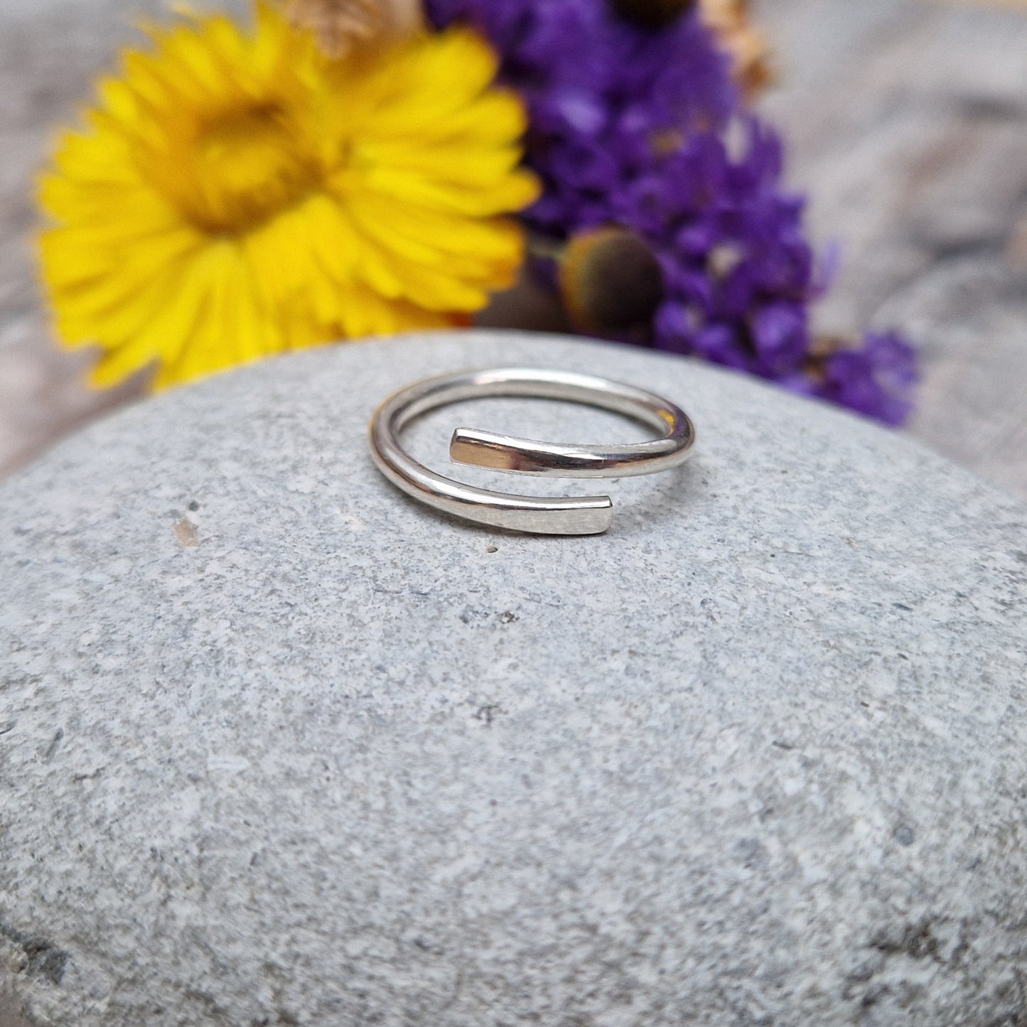 Sterling Silver ring that wraps around the finger and overlaps.