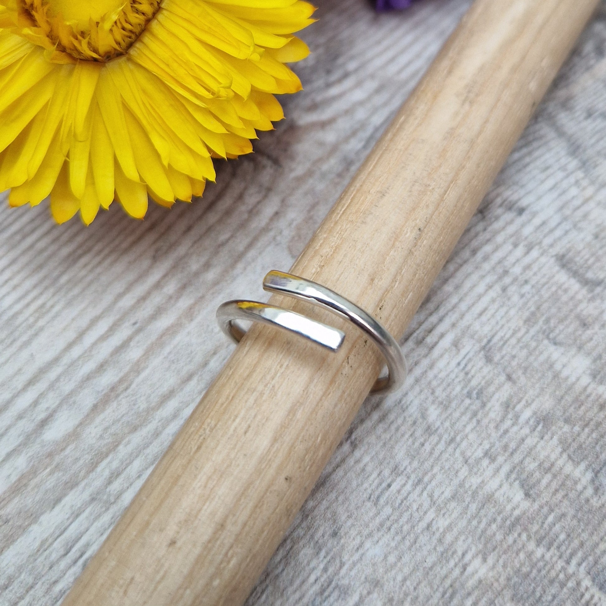 Sterling Silver ring that wraps around the finger and overlaps.