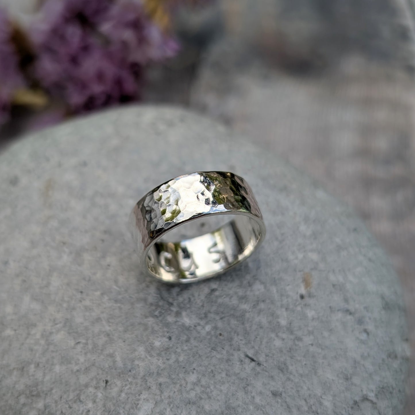 Sterling silver wide ring band with hammered texture finish and high polish. F O C U S stamped on the inside of the band.