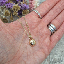 Load image into Gallery viewer, 9ct Gold hammered pebble necklace. Pebble shaped pendant with hammered texture suspended from 9ct gold chain via two small, gold circular links.