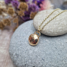 Load image into Gallery viewer, 9ct Gold hammered pebble necklace. Pebble shaped pendant with hammered texture suspended from 9ct gold chain via two small, gold circular links.