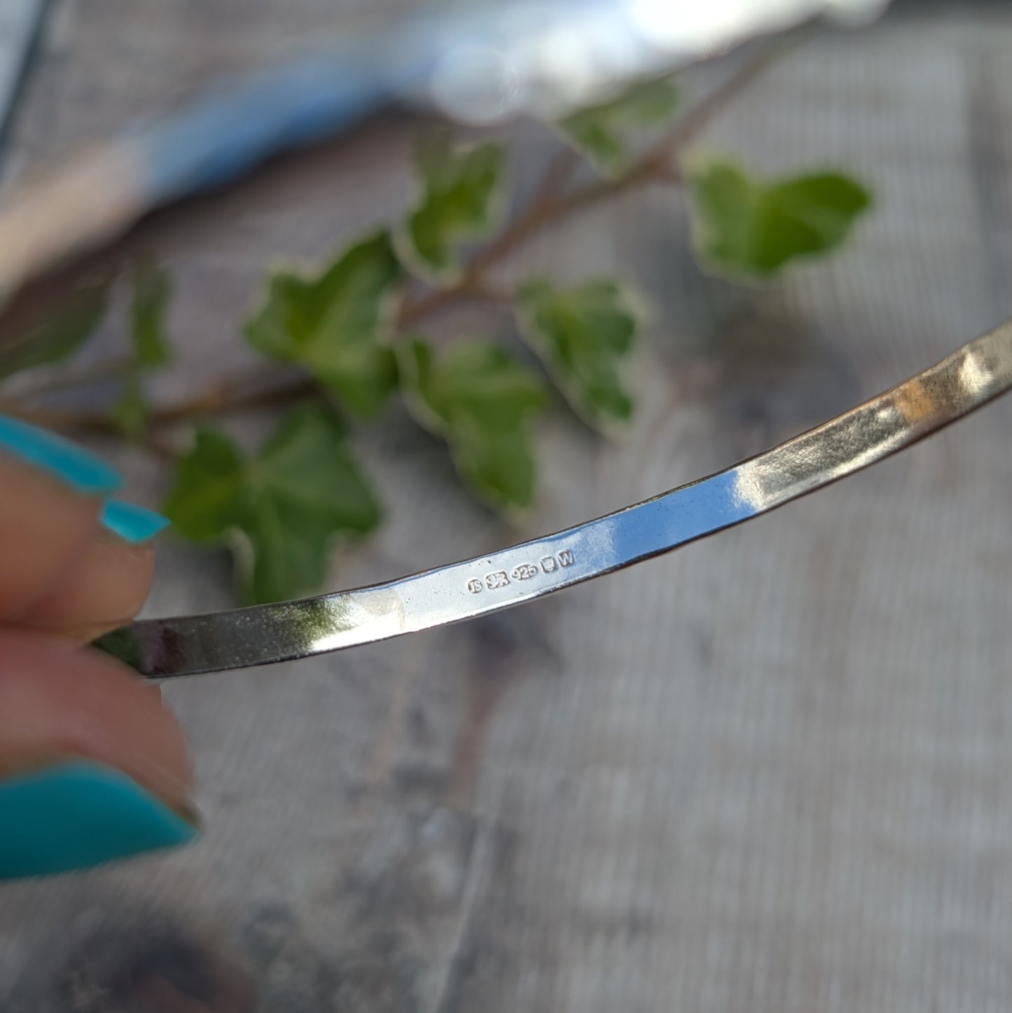 Inside view of a Hammered Sterling Silver D Shape Bangle showing the hallmark on recycled Sterling Silver D shaped wire.