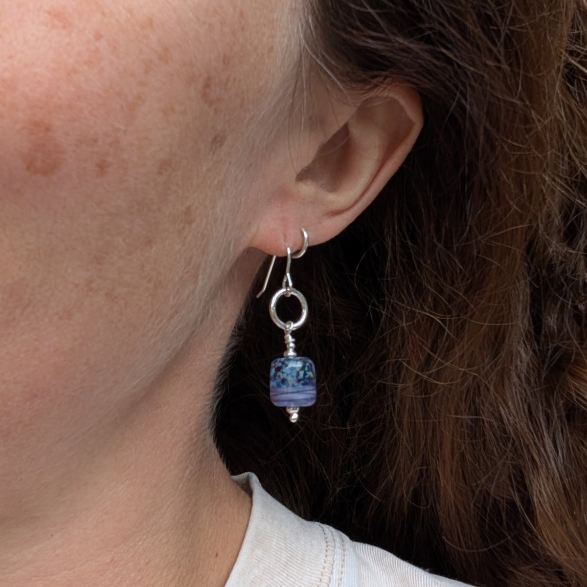 Lilac Watercolour Lampwork Glass and Silver Circle Earrings being worn, showing the size and drop of the handmade silver and glass earrings.