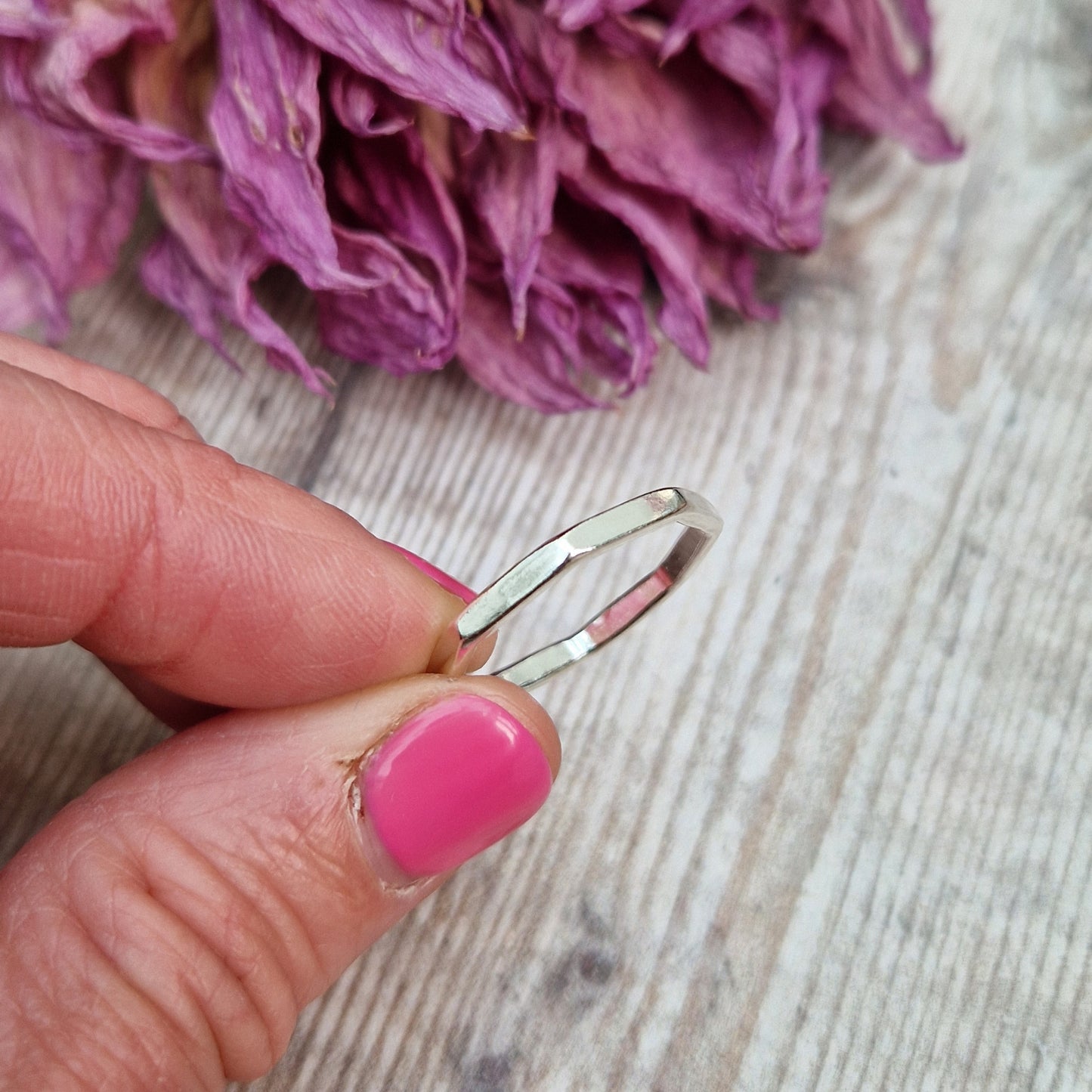 Sterling Silver octagonal shaped ring with flat sides on each edge of the octagon shape.