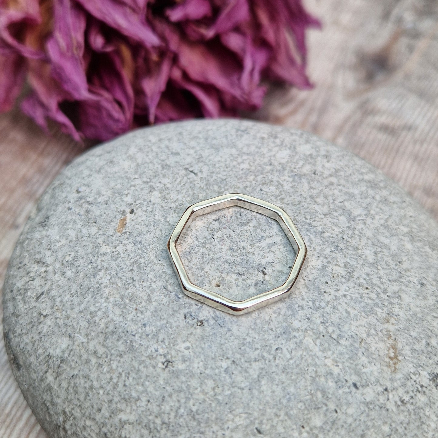 Sterling Silver octagonal shaped ring with flat sides on each edge of the octagon shape.