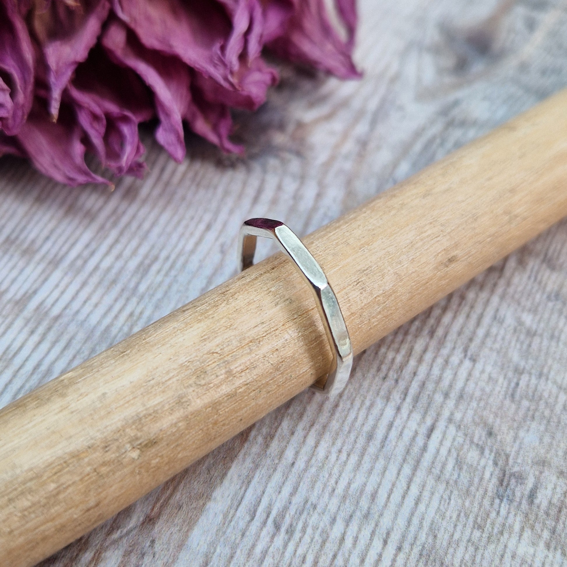 Sterling Silver octagonal shaped ring with flat sides on each edge of the octagon shape.