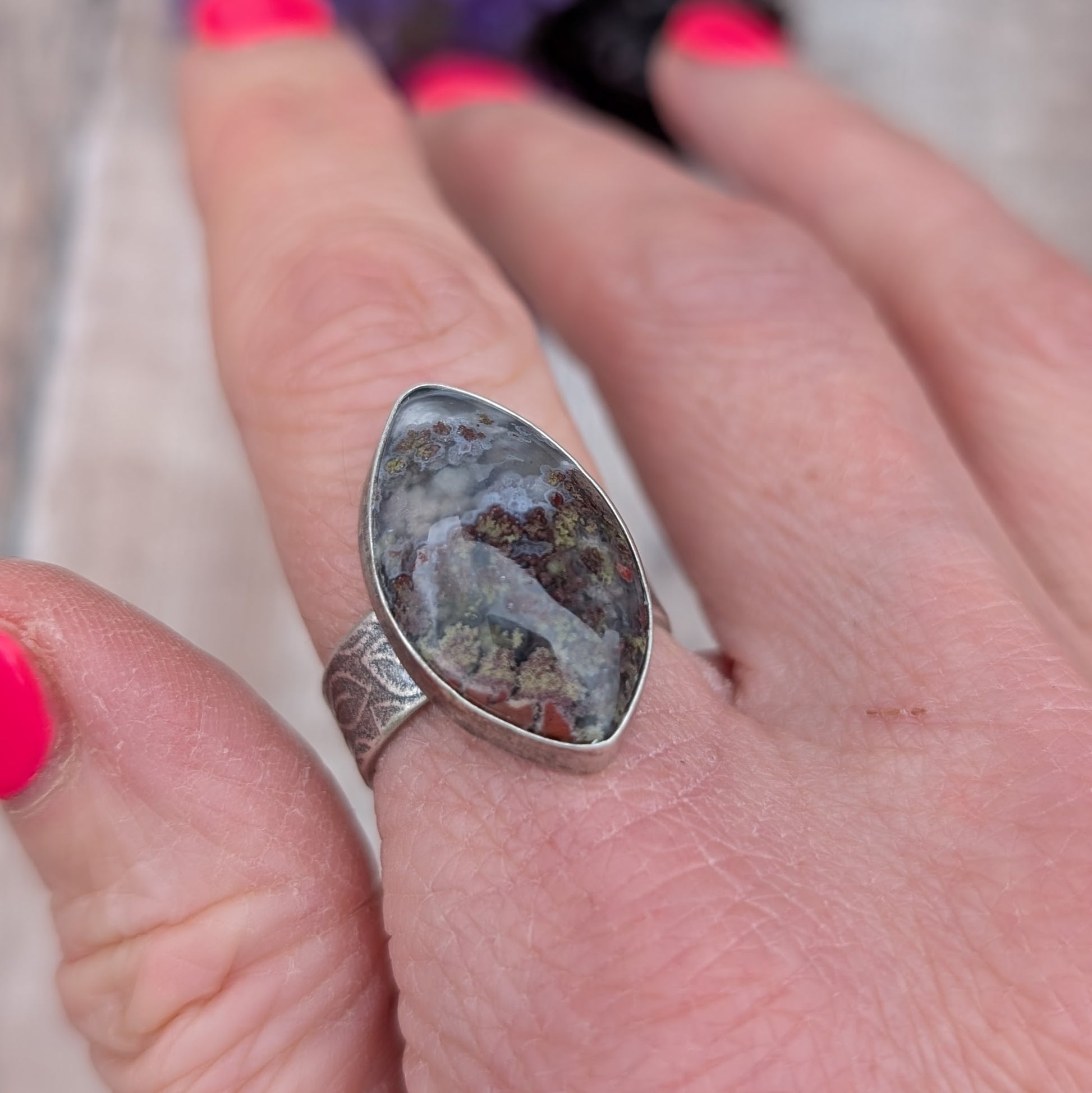 Silver Plume Agate Ring worn on hand, showing leaf pattern band and detailed plume agate stone