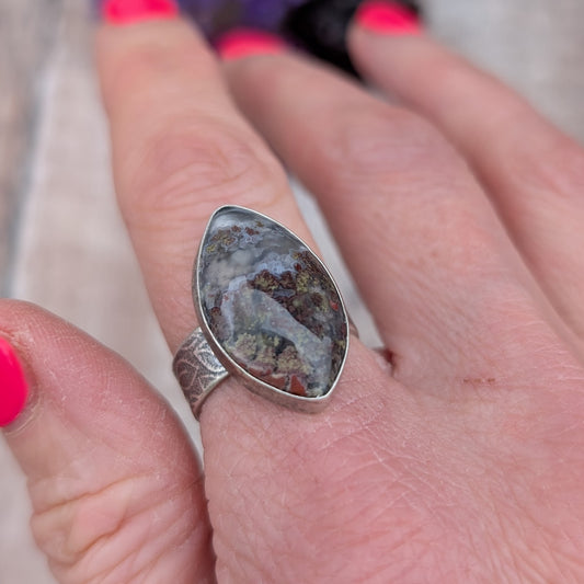 Silver Plume Agate Ring worn on hand, showing leaf pattern band and detailed plume agate stone