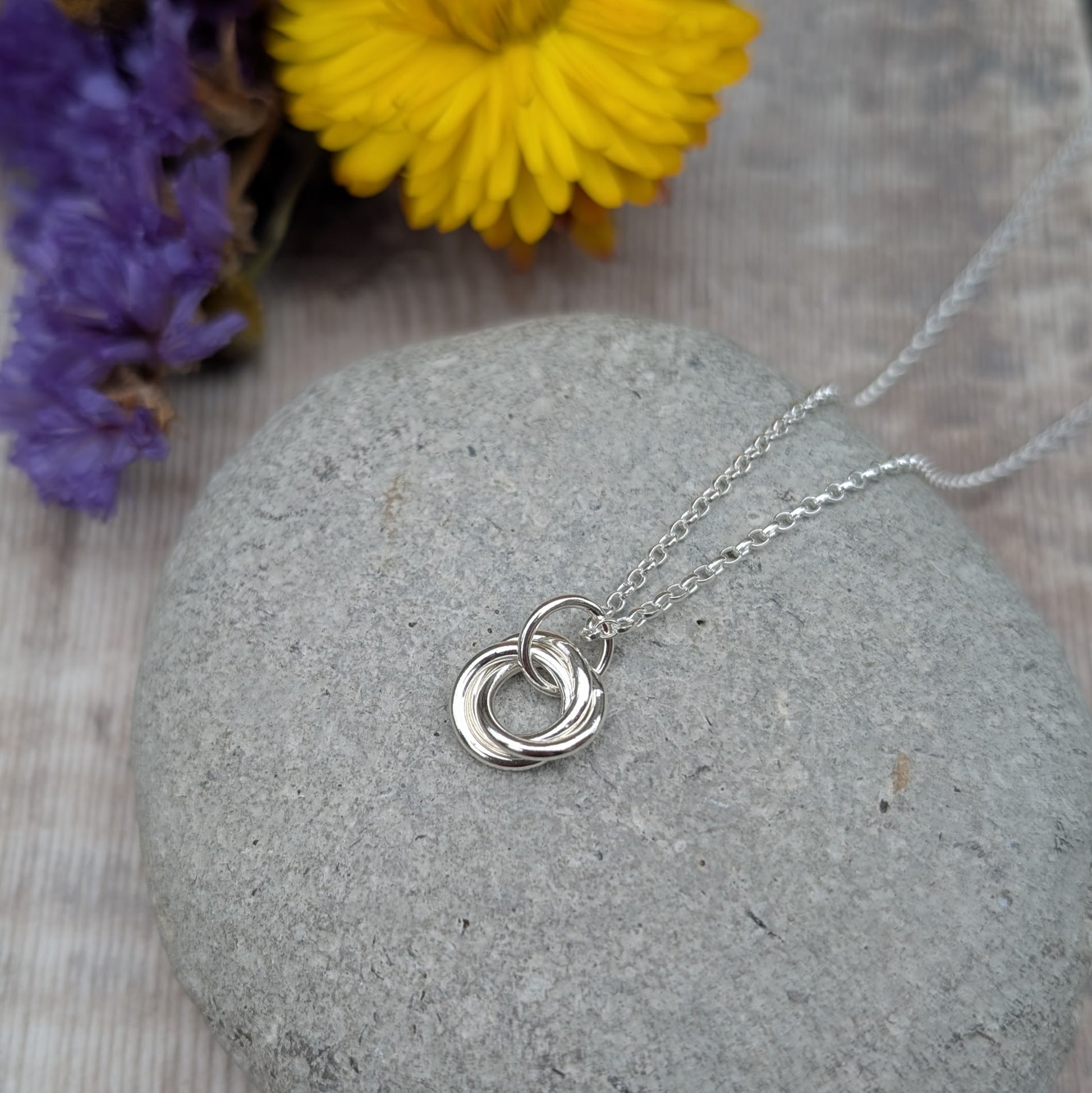 Sterling Silver three linked Russian Ring necklace. Three open circles, approx. 12mm diameter, linked together as a Russian Ring (rings entwined). Suspended from a silver chain via silver open circle link.