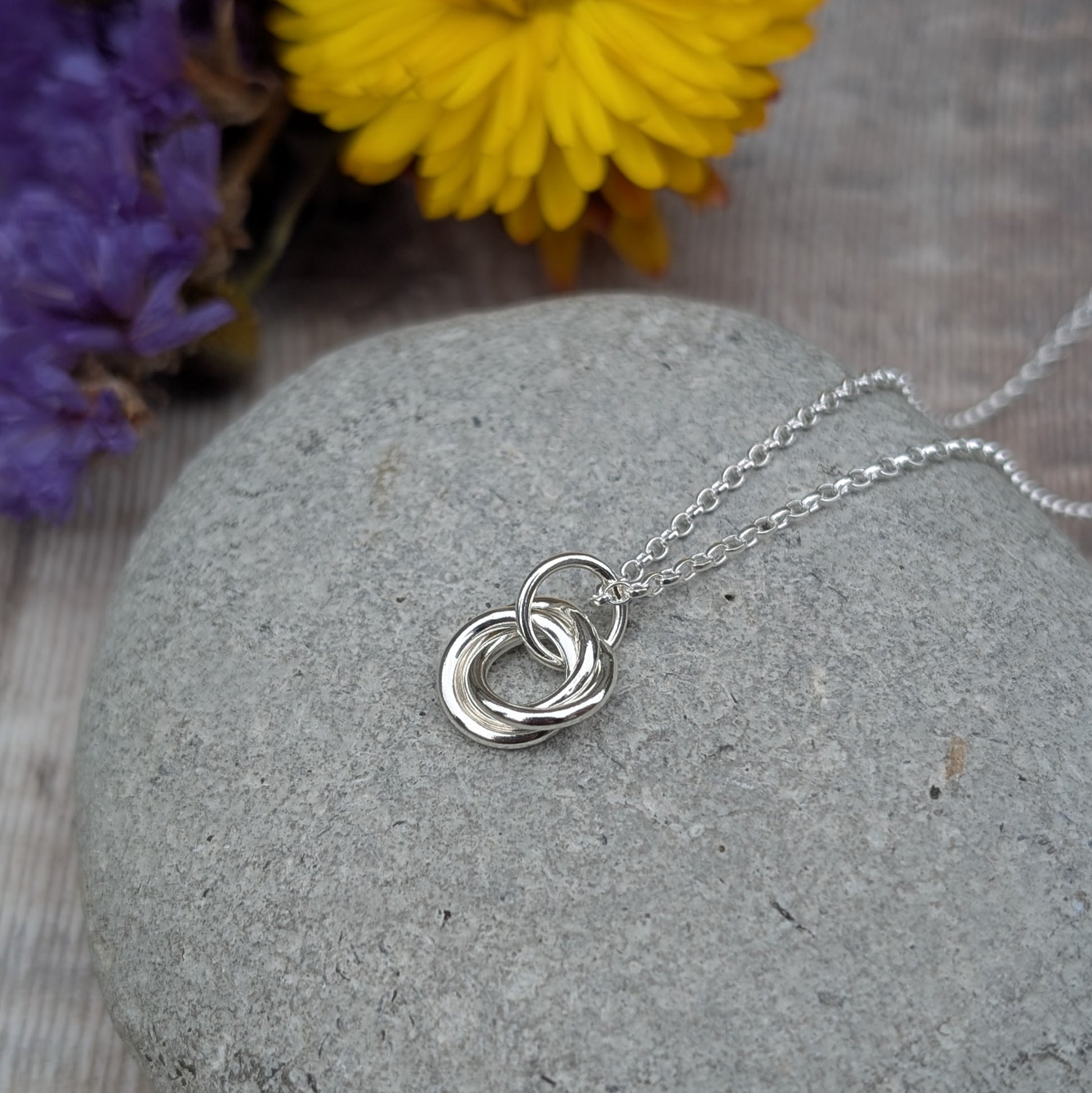 Sterling Silver three linked Russian Ring necklace. Three open circles, approx. 12mm diameter, linked together as a Russian Ring (rings entwined). Suspended from a silver chain via silver open circle link.