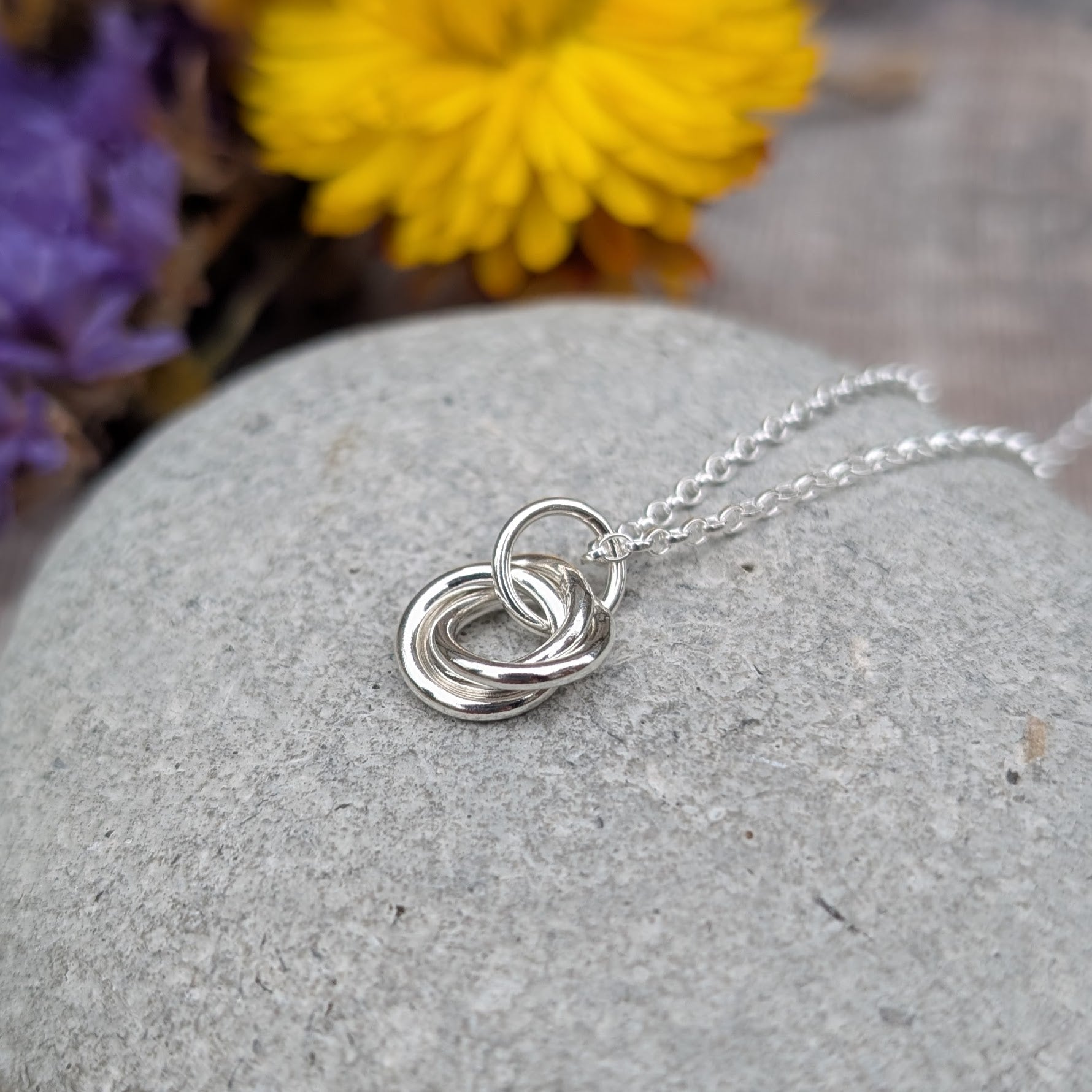 Sterling Silver three linked Russian Ring necklace. Three open circles, approx. 12mm diameter, linked together as a Russian Ring (rings entwined). Suspended from a silver chain via silver open circle link.