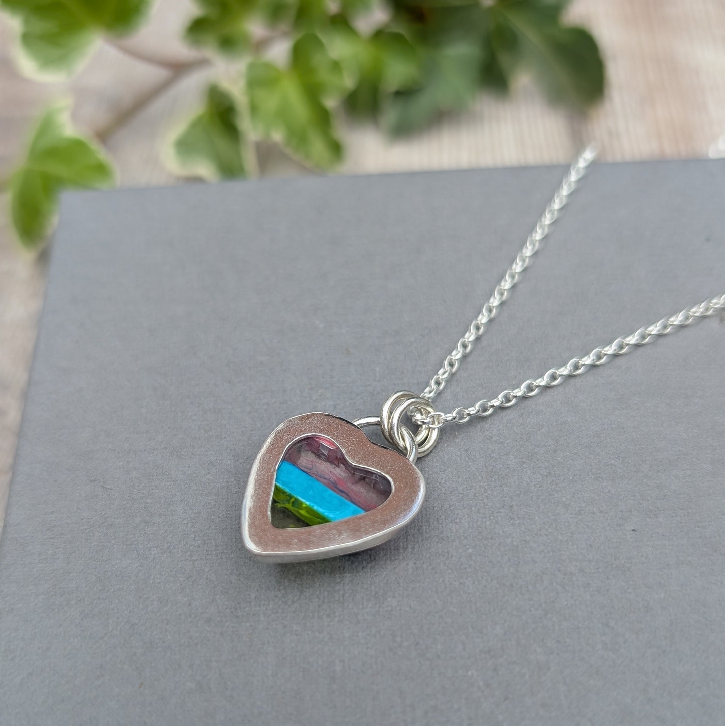 Back view of Silver Multicoloured Surfite Heart Necklace showing the open heart detail and colourful Surfite through the back.