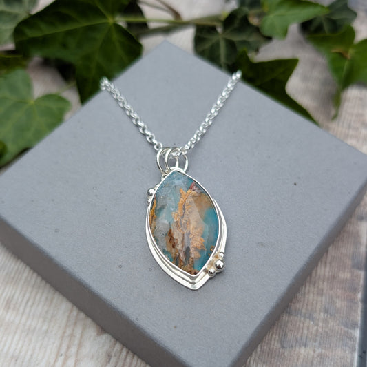 Silver Regency Rose Plume Agate Necklace displayed on a grey jewellery box with ivy in the background, featuring a handmade recycled Sterling Silver setting.