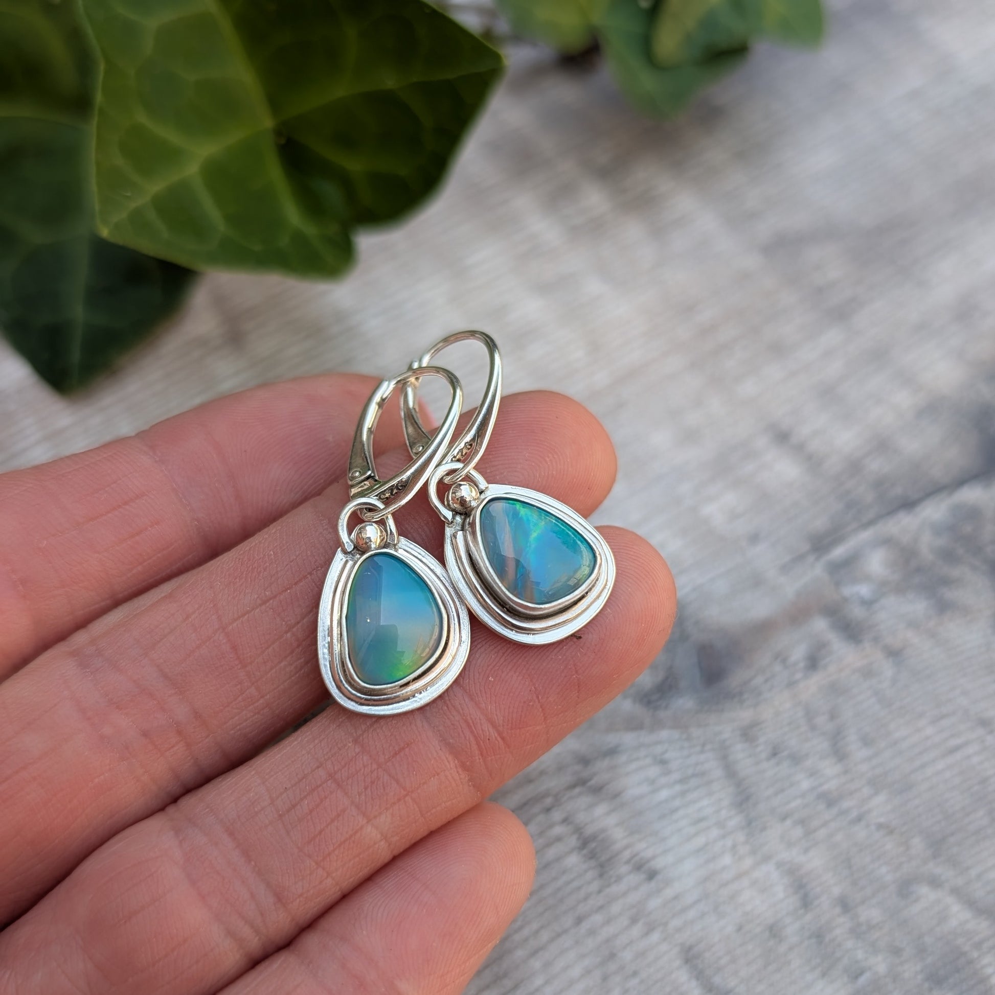 Turquoise Blue Aurora Opal Teardrop Earrings in recycled Sterling Silver, close up showing the unique handmade silver settings and colourful Aurora Opals.