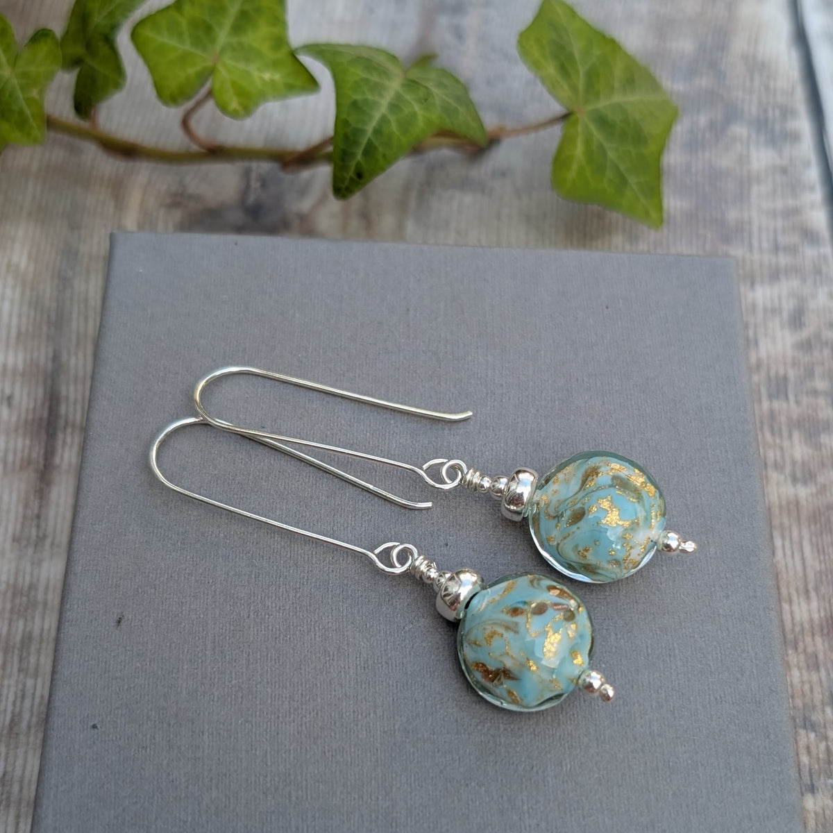turquoise marbled Venetian glass long silver earrings with handmade turquoise and gold lampwork glass beads and long recycled sterling silver ear wires.