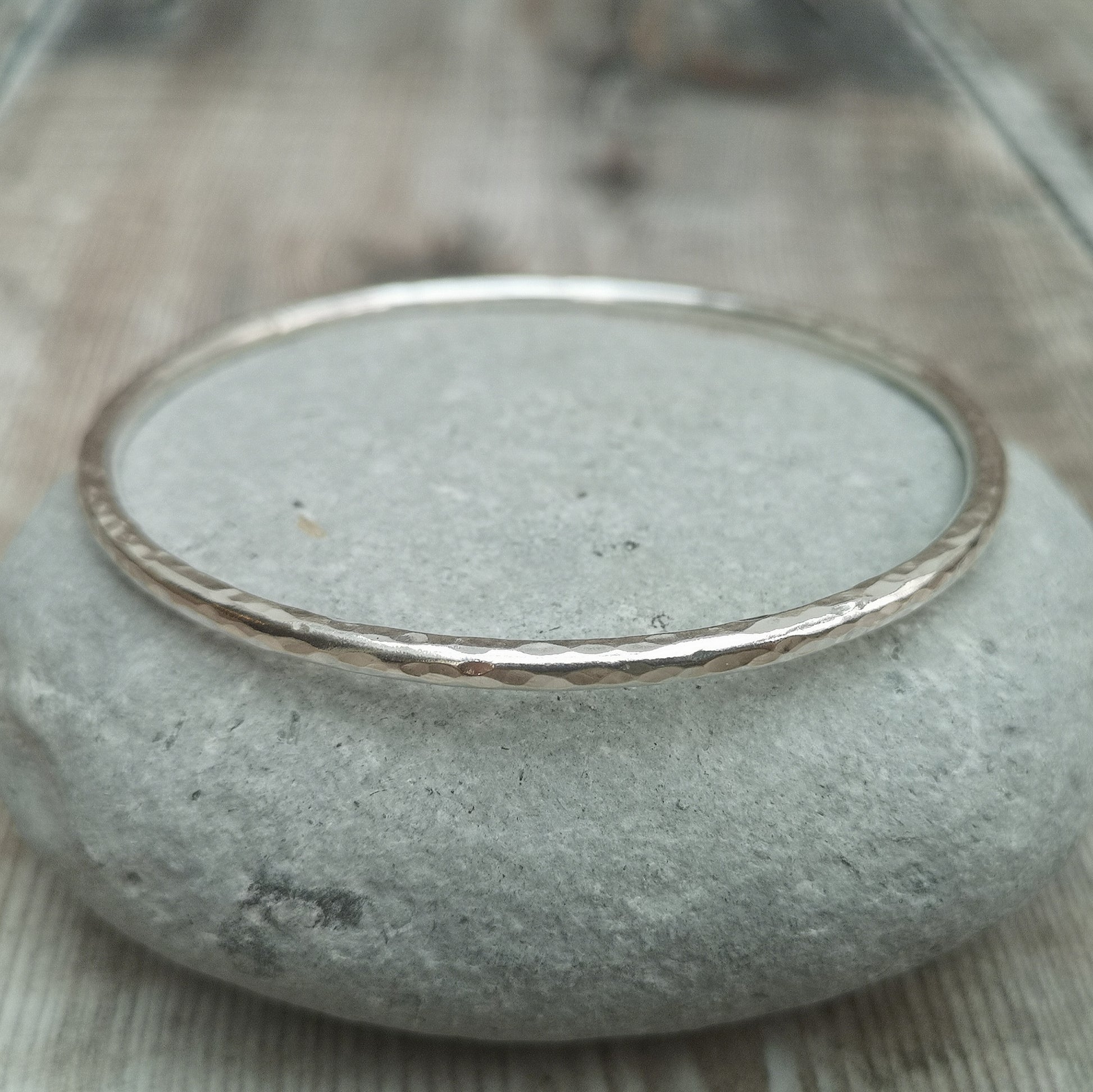 Sterling Silver bangle with hammered texture finish.