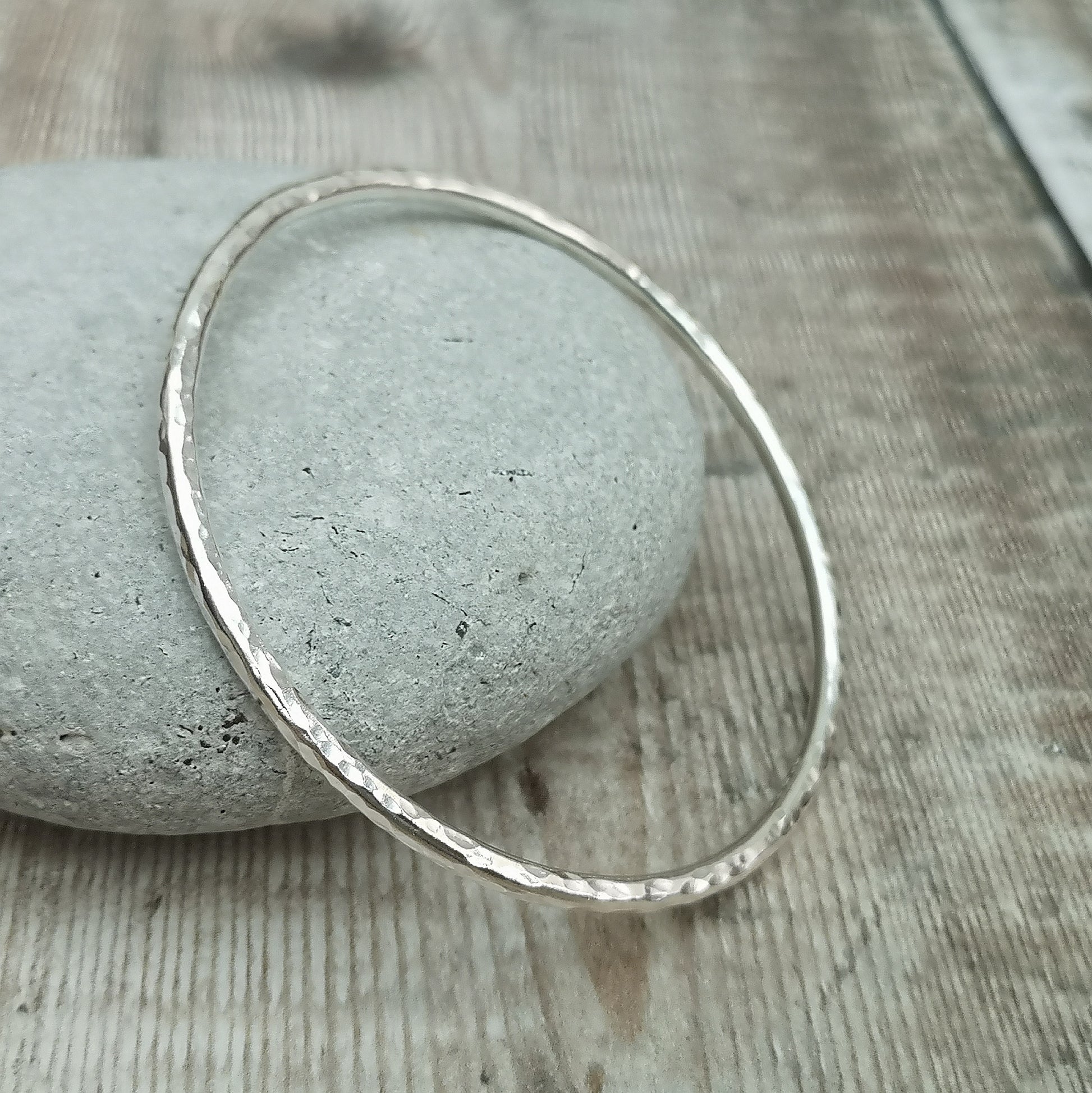 Sterling Silver bangle with hammered texture finish.