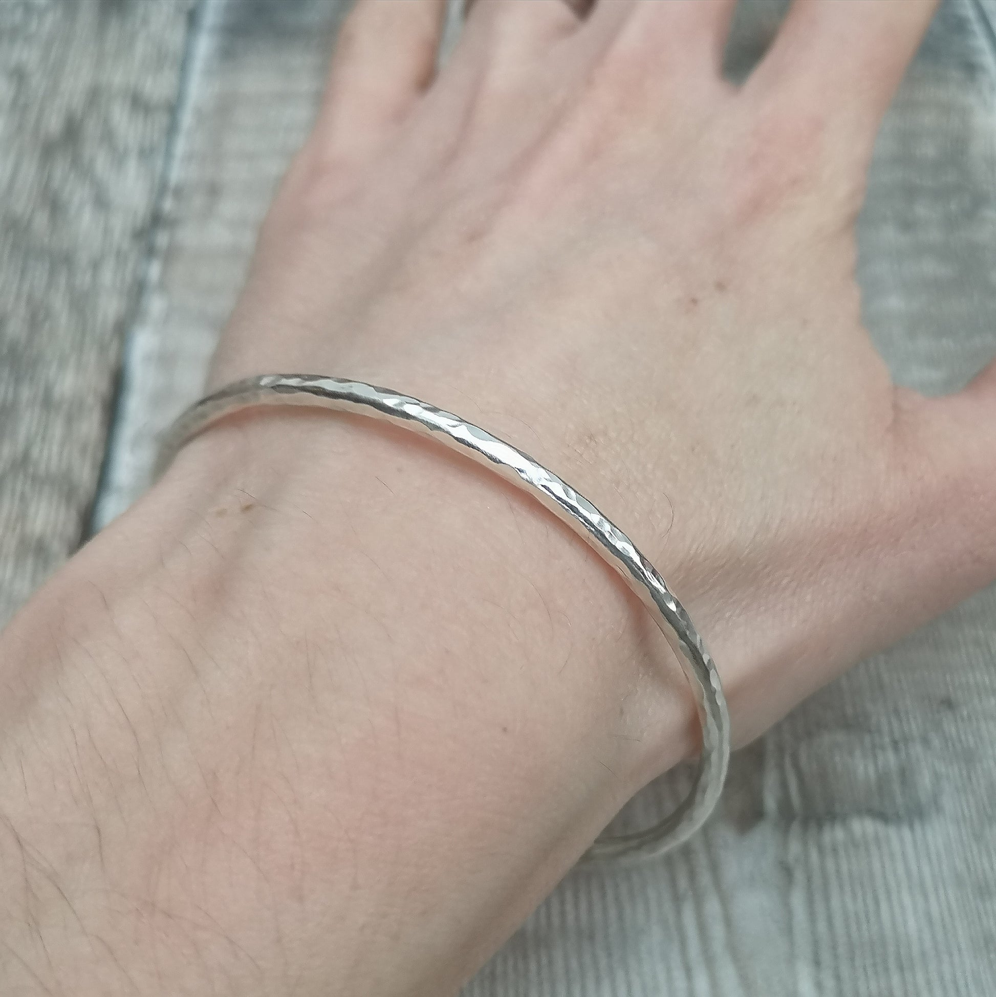 Sterling Silver bangle with hammered texture finish.