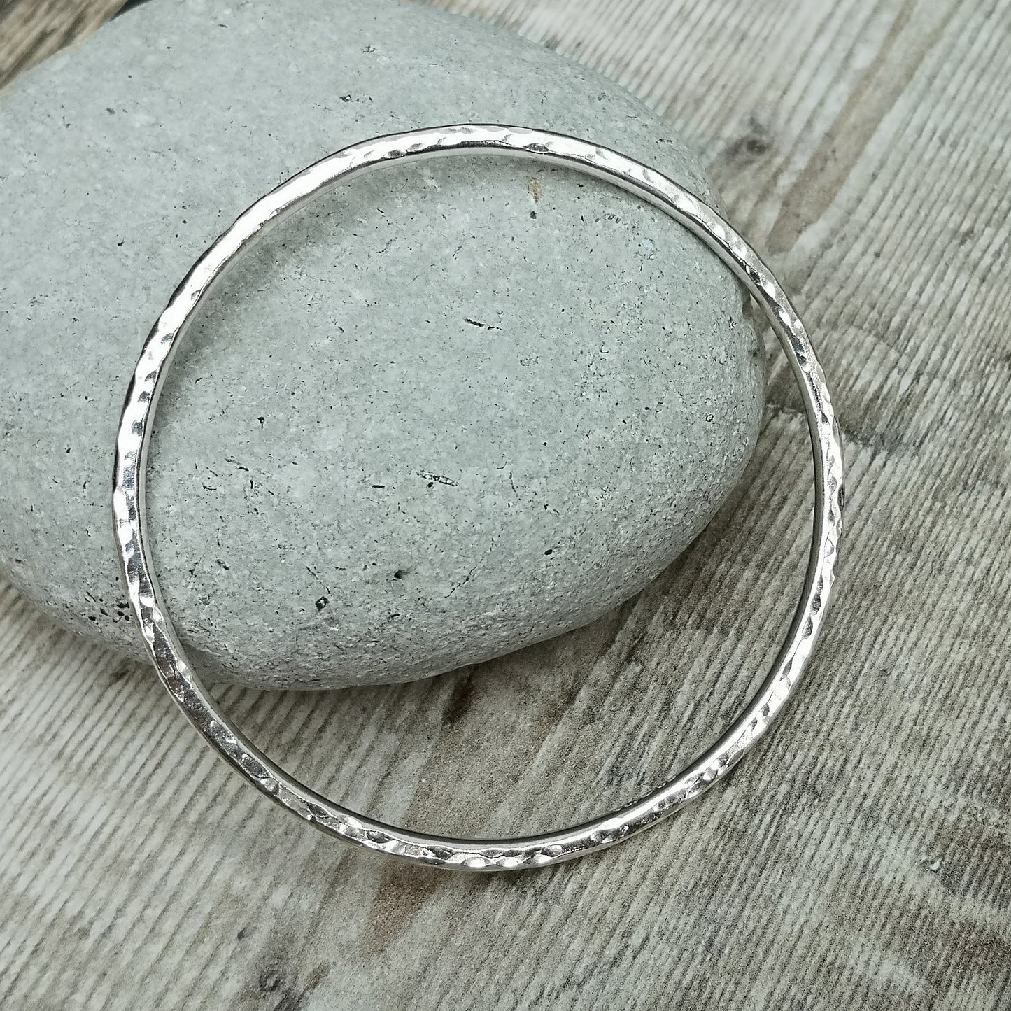 Sterling Silver bangle with hammered texture finish.